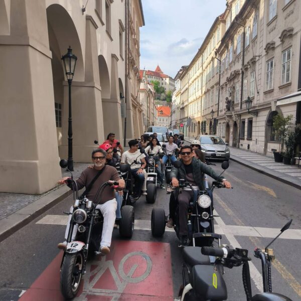 Couples rides on escooters in Prague